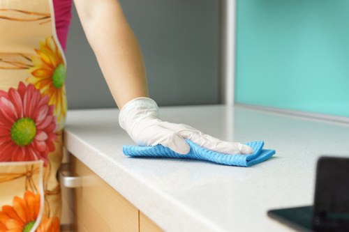 Cleaning specialist working on a commercial seating stain in Notting Hill