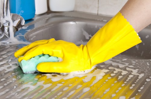 Local cleaner preparing a kitchen for a one off clean in Notting Hill