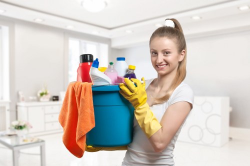 Local technician cleaning a range cooker in Notting Hill