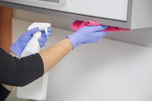 Local cleaner treating stains on a mattress in Notting Hill